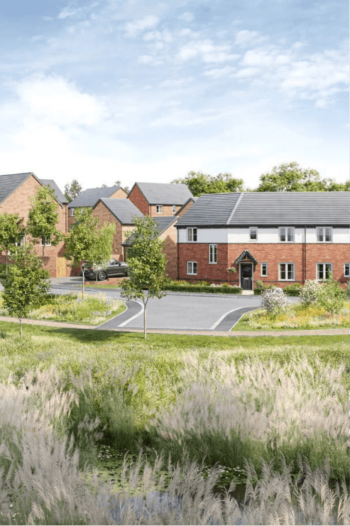 A new-build housing development featuring brick houses, landscaped green spaces, and a small pond in the foreground