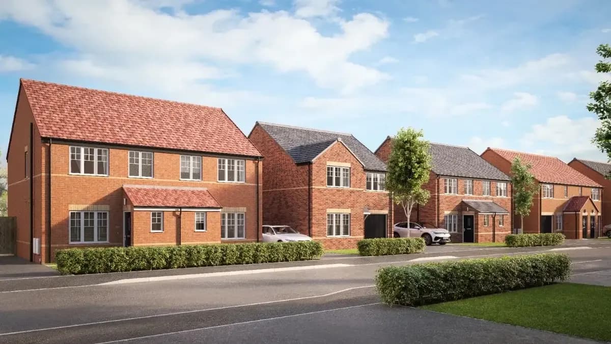 Digital render of a row of modern red brick houses with pitched roofs and green hedges at a new-build development