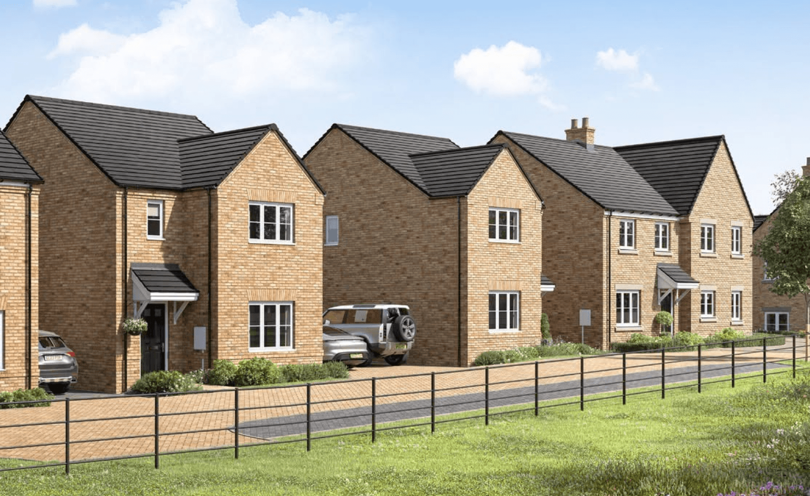 Row of modern detached brick houses with black tiled roofs, driveways, and a front perimeter fence