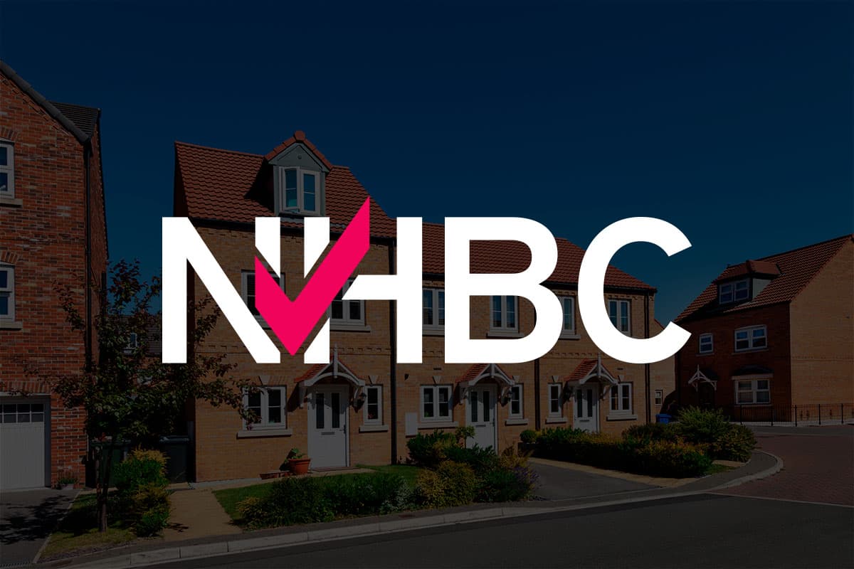 NHBC logo overlaid on a background of modern brick-built new-build houses in the UK